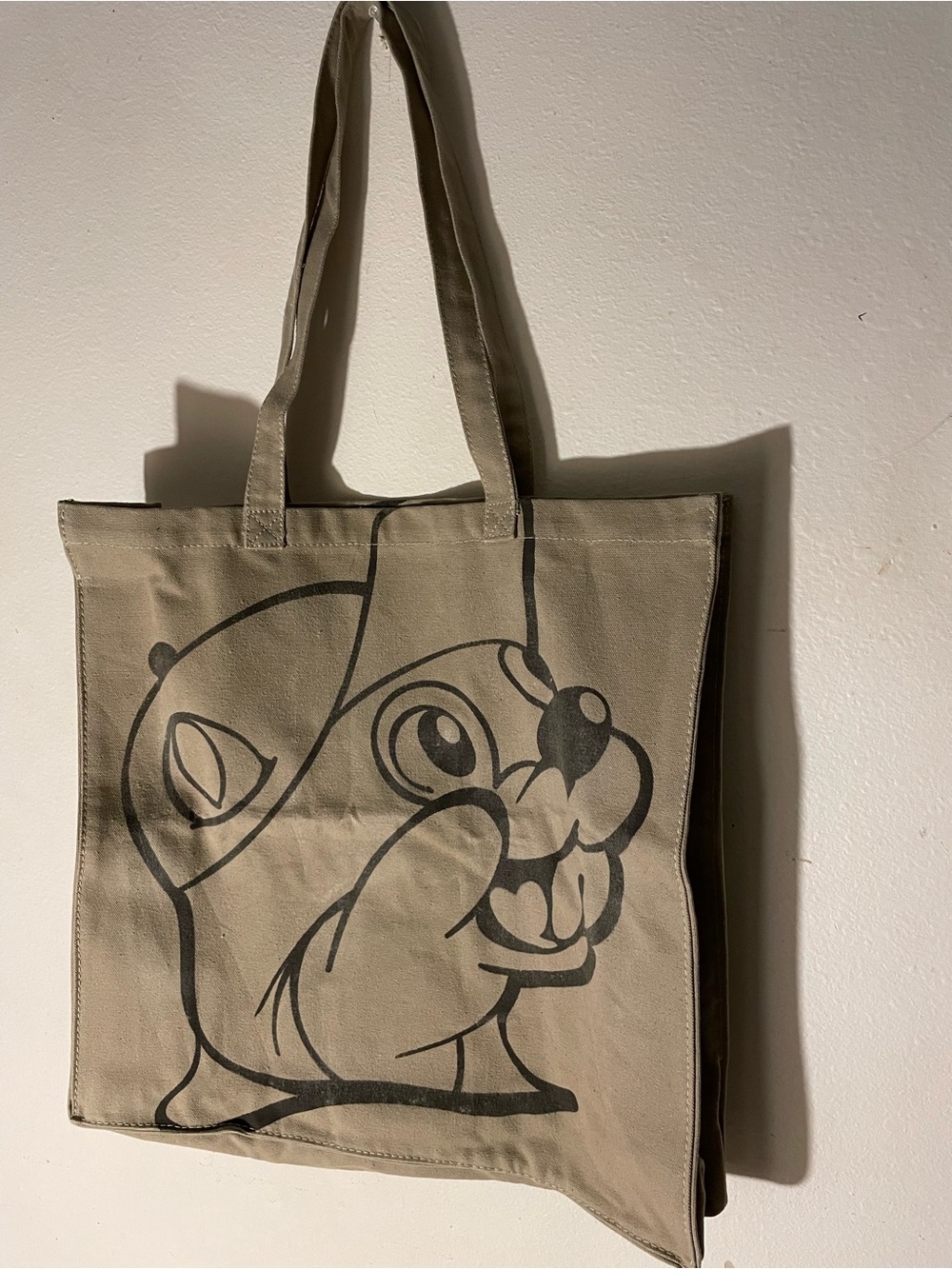Beige Canvas Tote Bag with Playful Black Cartoon Print